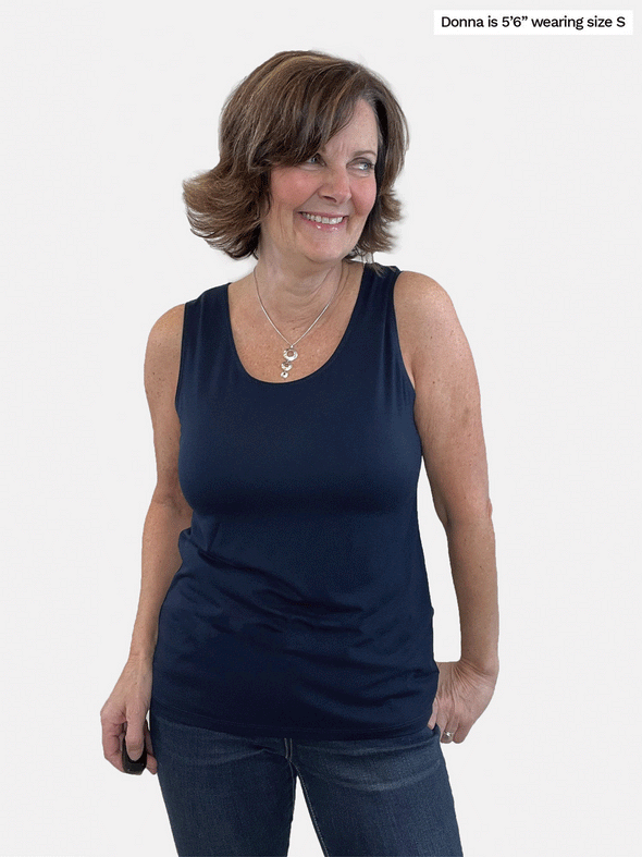 A GIF that shows Shandra reversible tank top reversing back-to-front, with one way showing a scoop neck and the other a high neck.