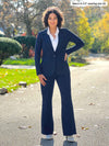 Miik model Meron (5'3", XS) wearing Sienna girlfriend blazer in navy buttoned over a collared white shirt and a navy wide leg pant 