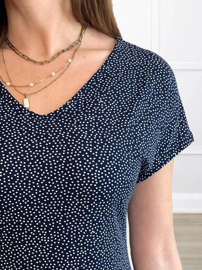 A closeup detail of the neckline of Miik&