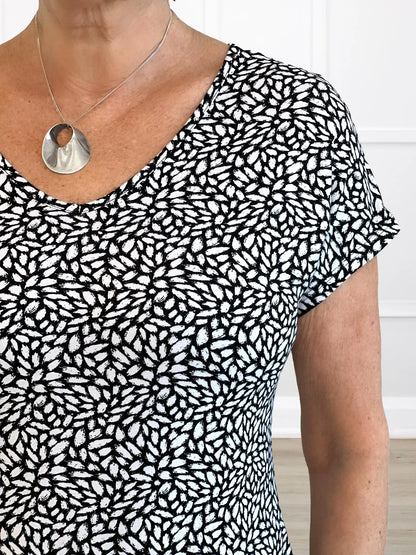 A closeup detail of the neckline of Miik&