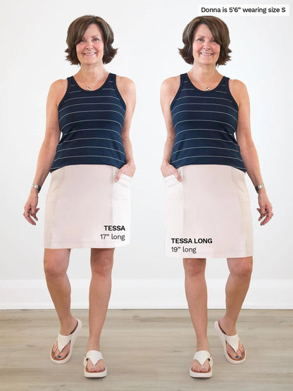 Woman modeling side by side images of the Tessa high waisted pocket skort in sandstone, in regular vs. long 