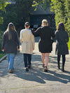 Miik models Christal, Meron, Bri and Yasmine standing next to each other with their back towards the camera showing the back of Miik's Vula belted cardigan with pockets.