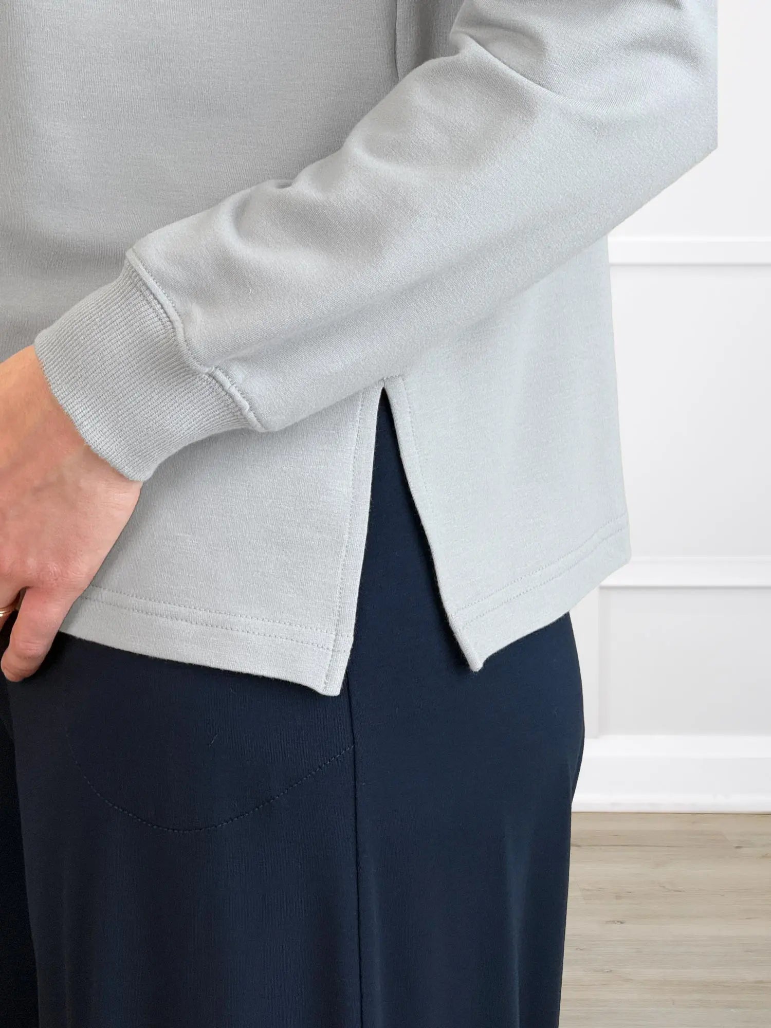 A closeup detail of the hemline of Miik&