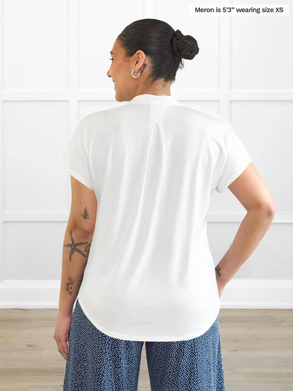 Miik model Meron (5’3”, xsmall) standing with her back towards the camera showing the back of Miik&