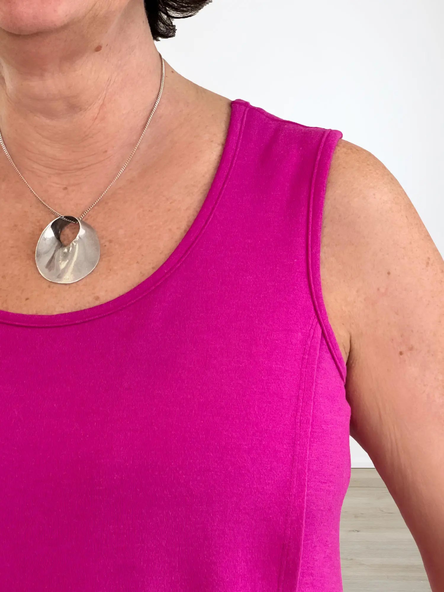 A closeup of the Yuki neckline and tank top strap detail that is wide and bra-friendly. 