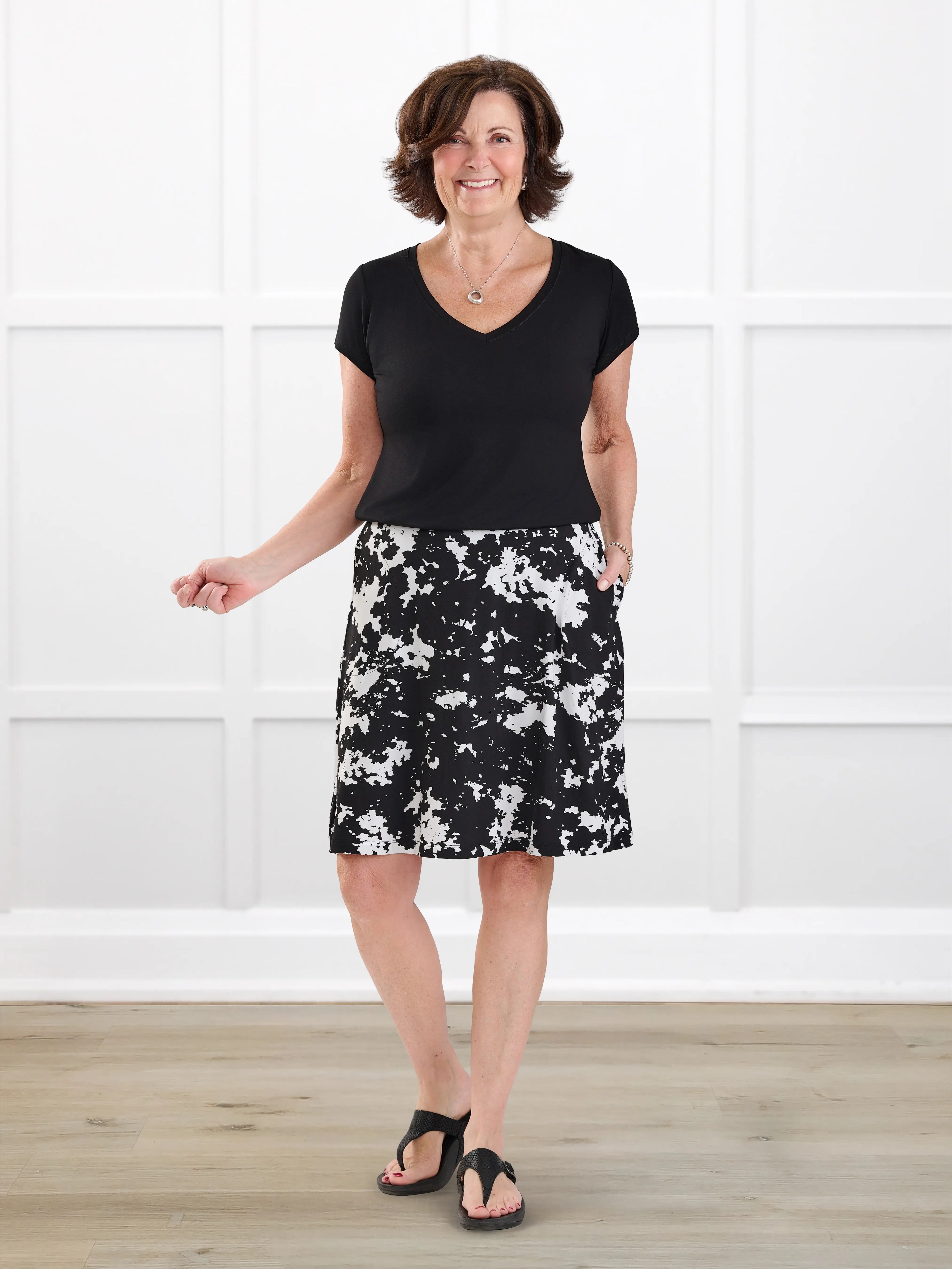 Adina flowy knee length pocket skort for women in Moo’d bloom on model Donna, size S @Donna-S 