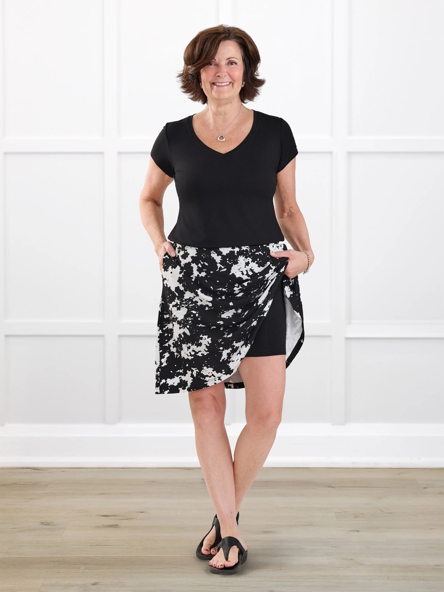 Adina flowy knee length pocket skort for women in Moo’d bloom on model Donna, size S @Donna-S 