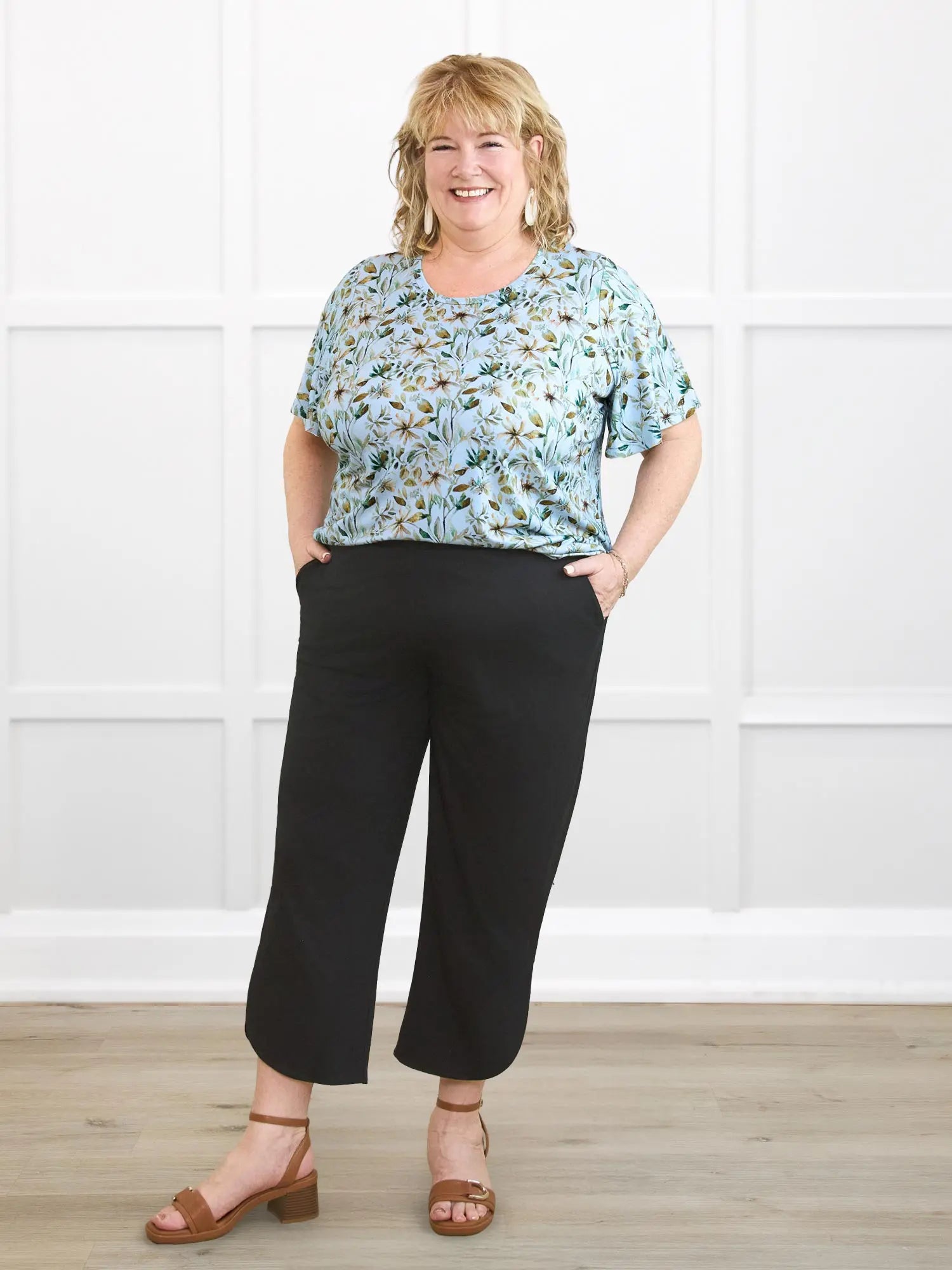 Akira tulip hem capri pant for women in Black on model Kelly, size 2X @Kelly-2X 