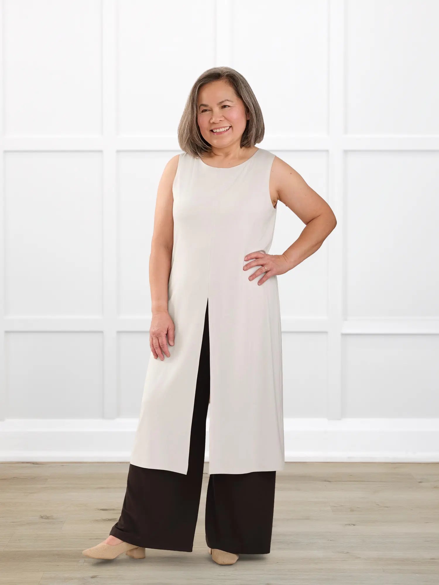 Alaya front slit sleeveless long tunic for women in Sandstone on model Terry, size S @Terry-S 