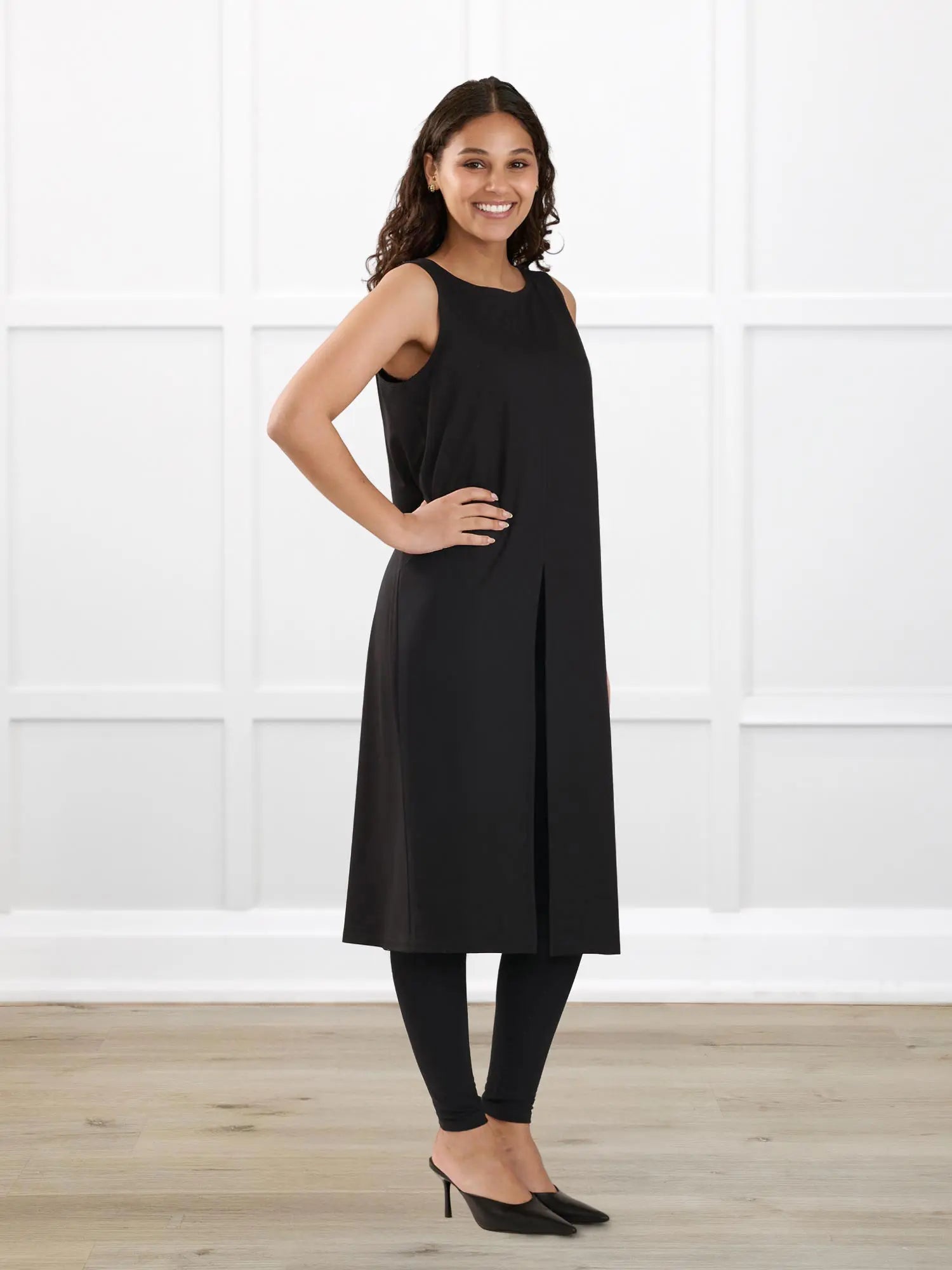Alaya front slit sleeveless long tunic for women in Black on model Meron, size XS @Meron-XS 