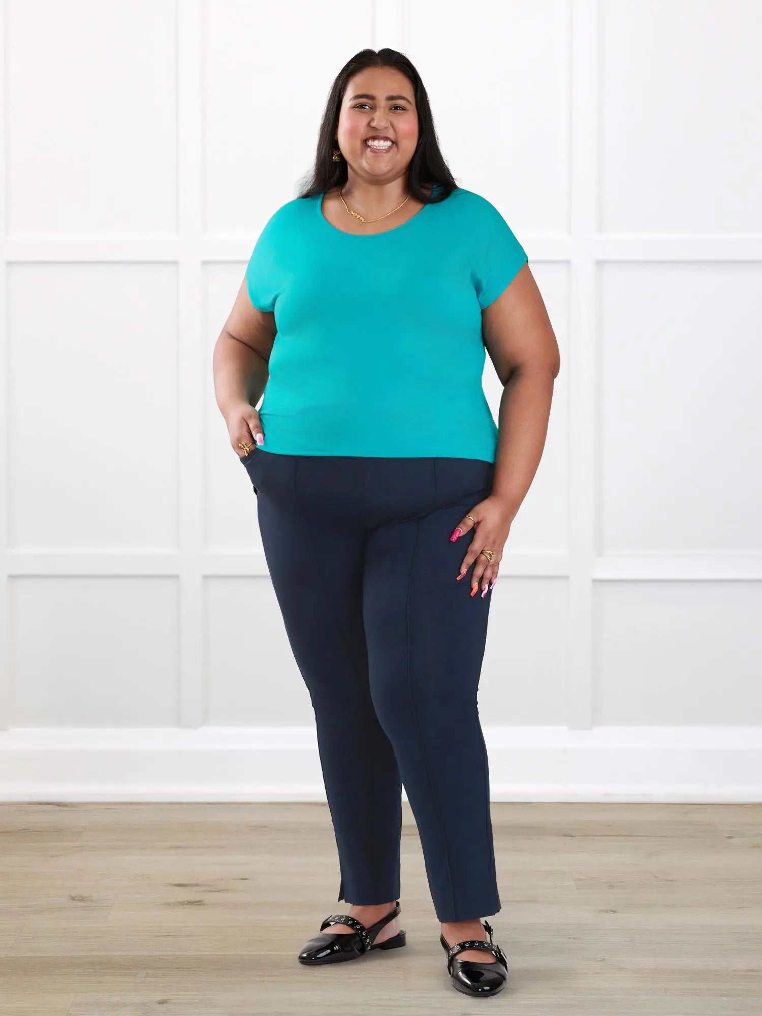 Christal pull on pintuck ankle pant for women in Navy on model Sureka, size 3X @Sureka-3x 