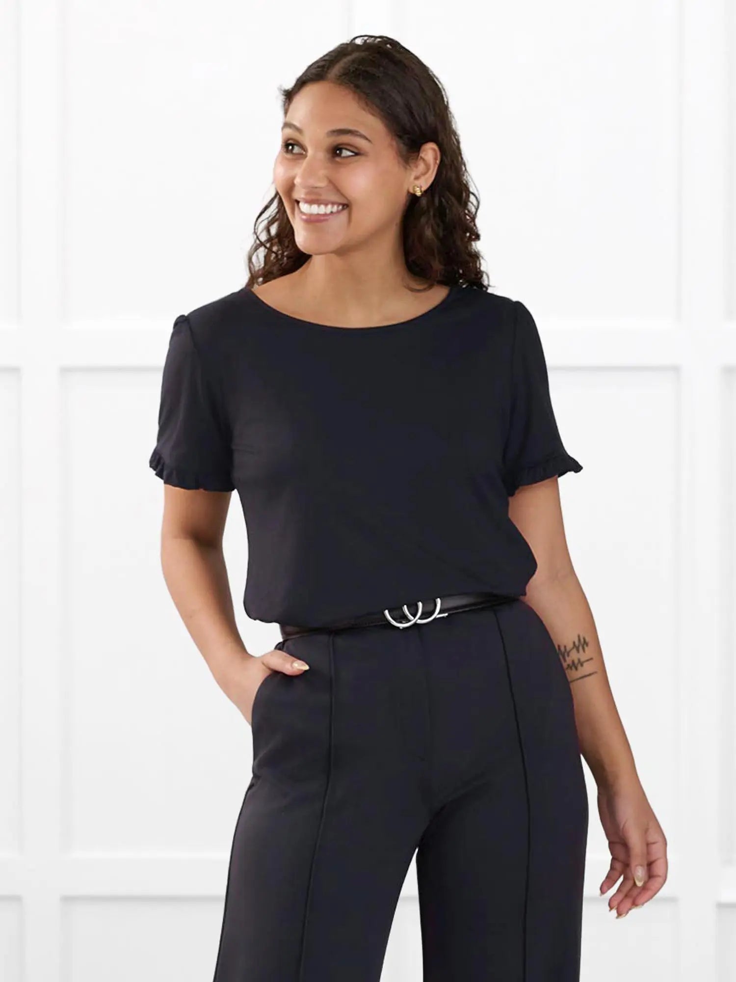 Darlene reversible neckline ruffle sleeve top for women in Black on model Meron, size XS @Meron-XS 