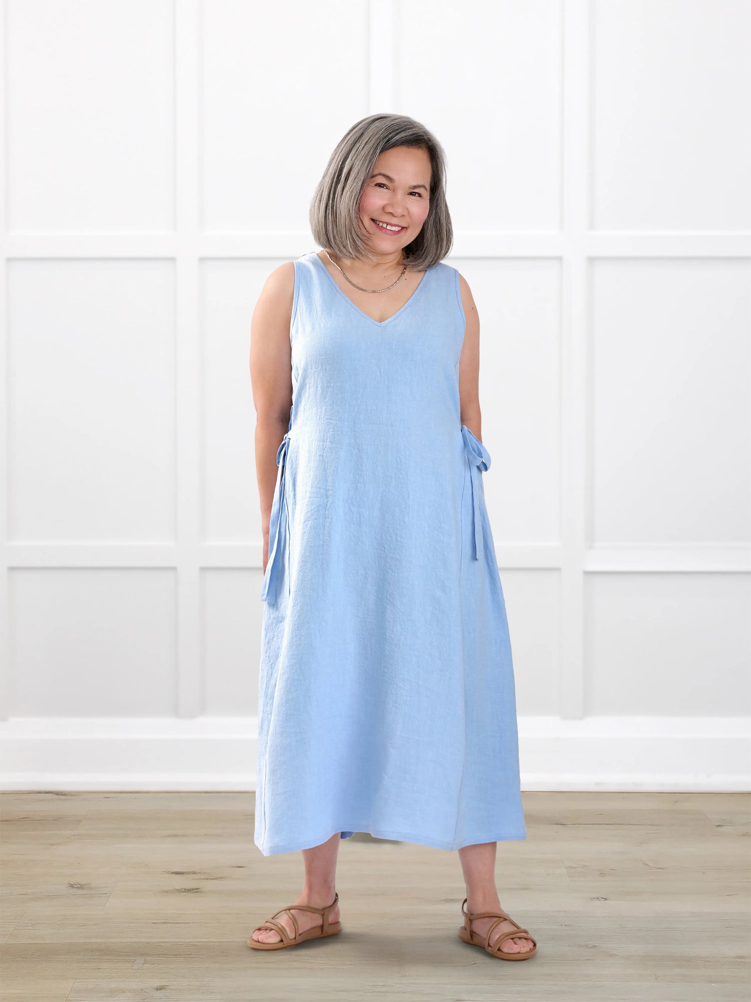 Delfina reversible neckline linen dress for women in Serene blue linen on model Terry, size XS @Terry-XS 