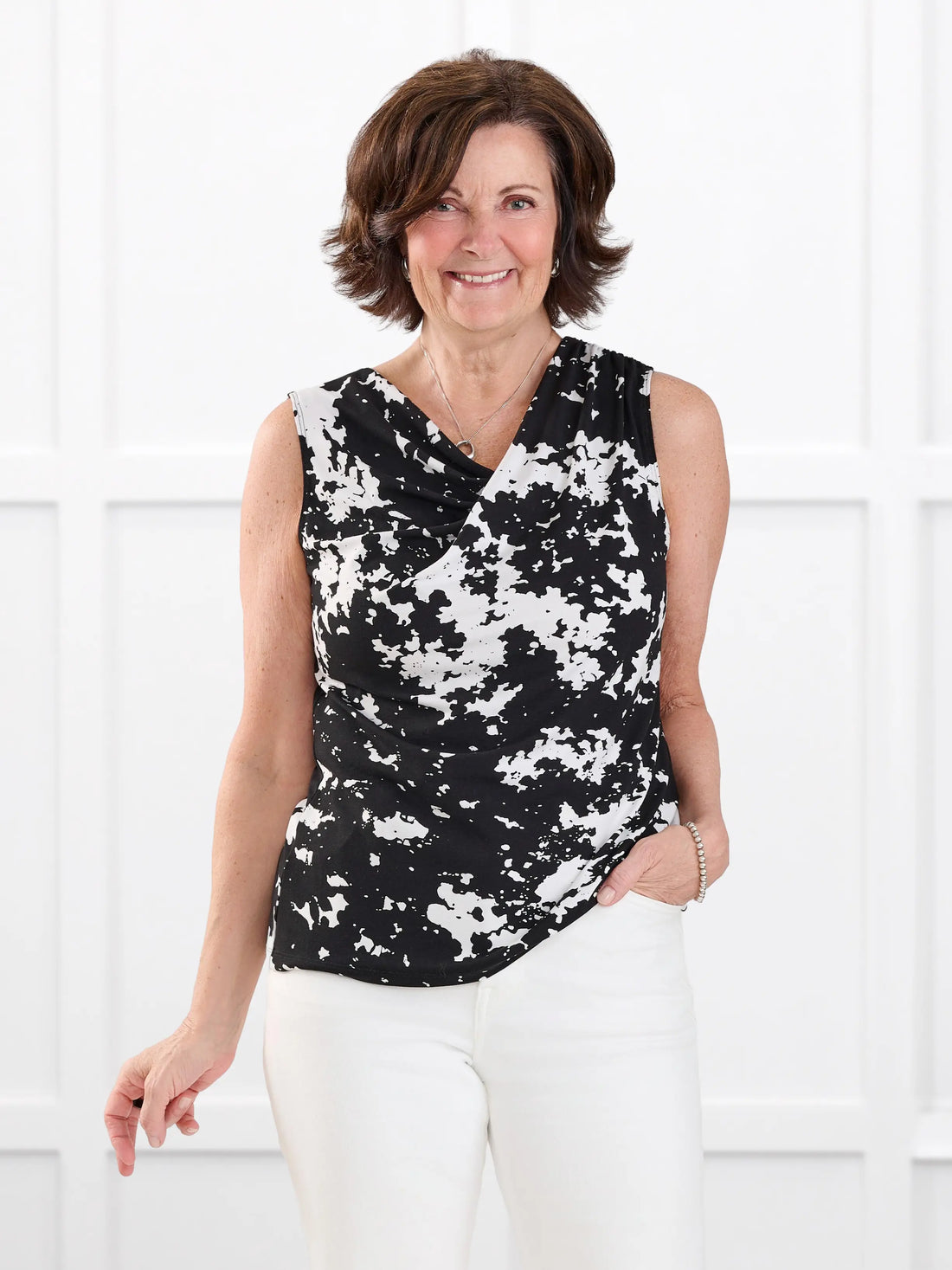 Dion sleeveless draped dressy top for women in Moo’d bloom on model Donna, size S @Donna-S 