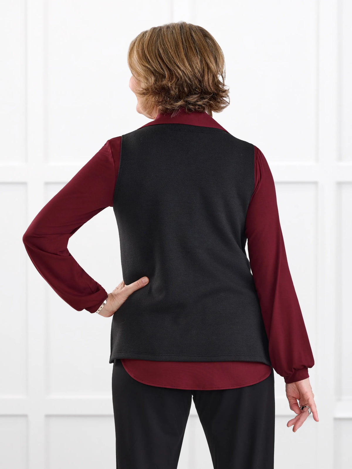 Dory v neck sweater vest for women in Black on model Donna, size S @Donna-S 