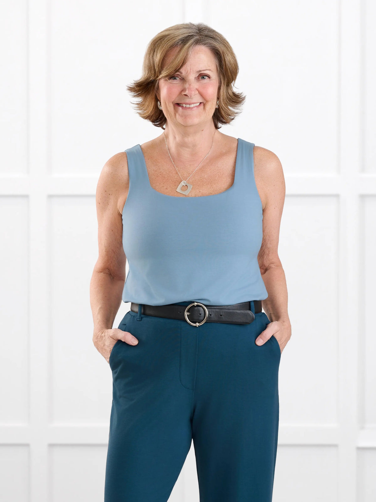 Eline reversible neckline shelf bra tank for women in Steel blue on model Donna, size S @Donna-S 