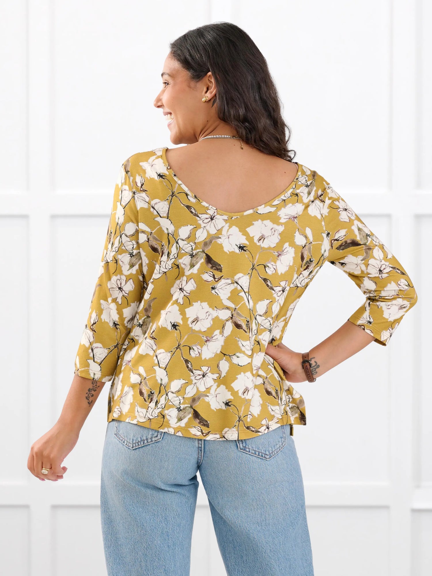 Fran reversible neckline sleeve top for women in Amber bloom on model Meron, size XS @Meron-XS 
