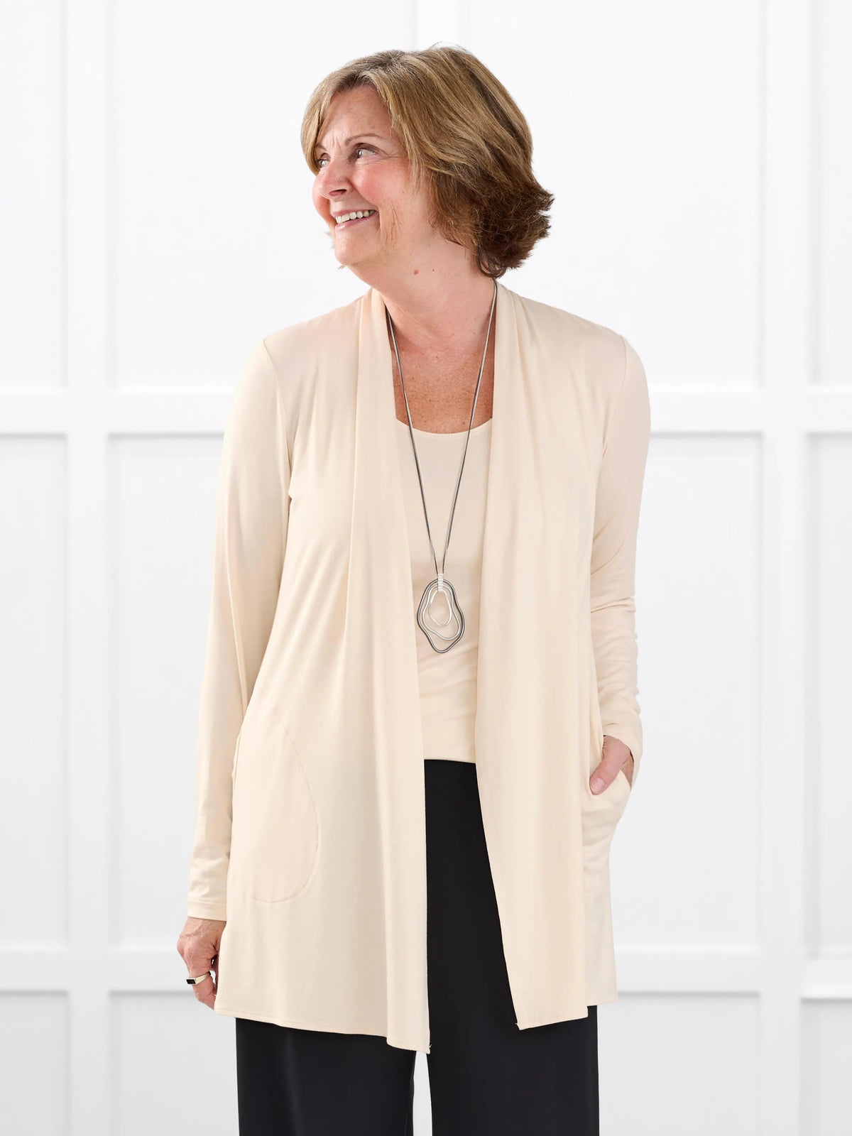 Georgina shawl collar pocket cardigan for women in Shortbread on model Donna, size S @Donna-S 