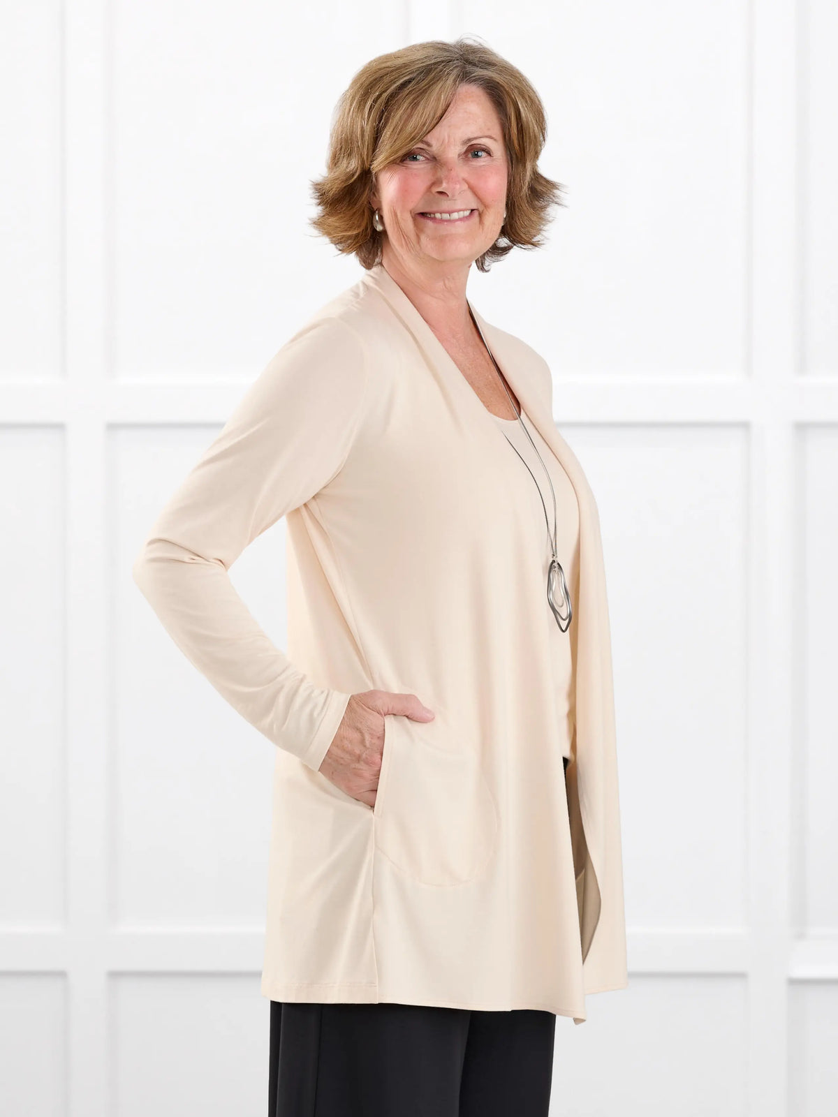 Georgina shawl collar pocket cardigan for women in Shortbread on model Donna, size S @Donna-S 