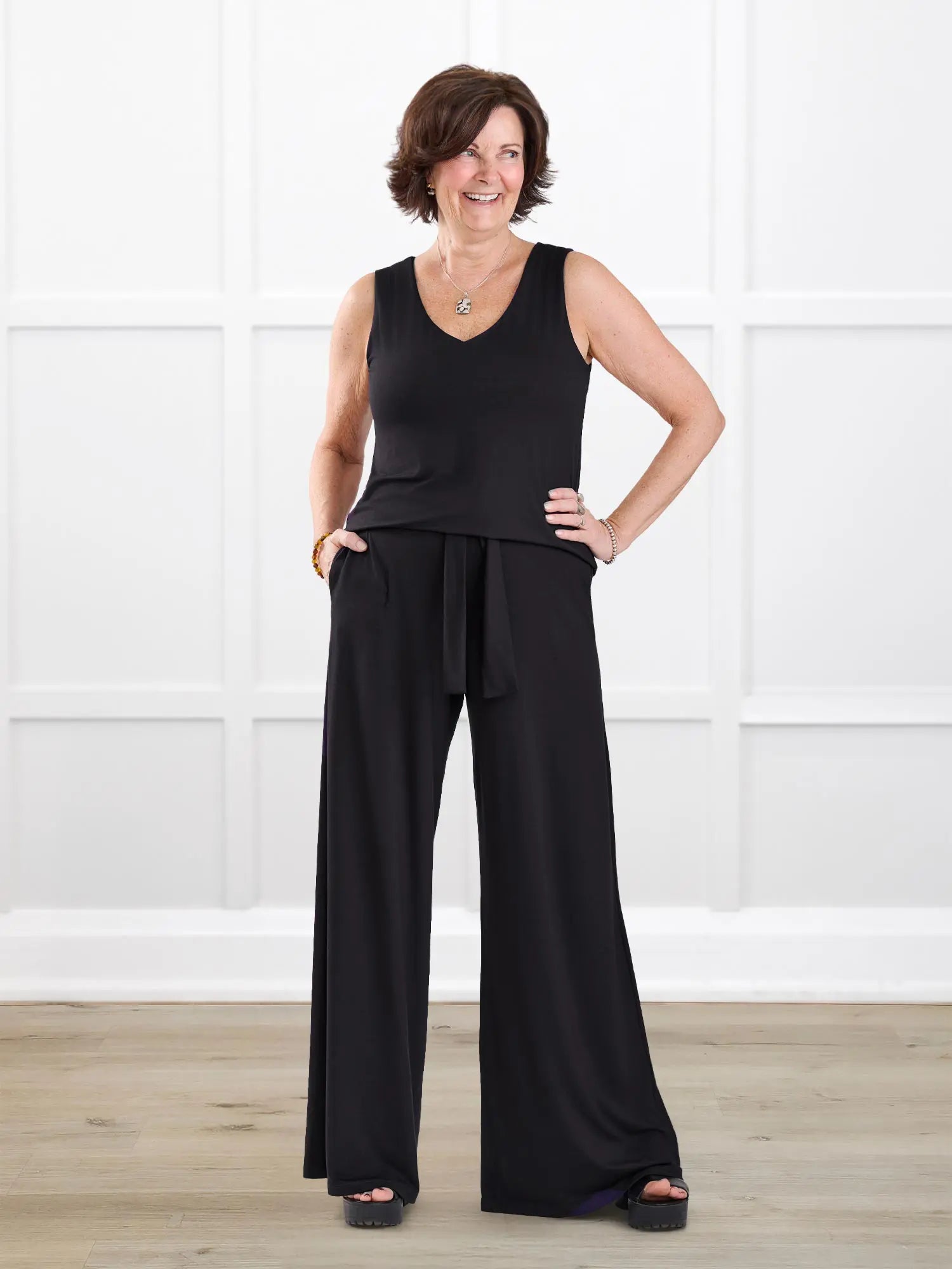 Janelle open back wide leg jumpsuit for women in Black on model Donna, size S Regular @Donna-S-regular 