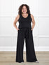 Janelle open back wide leg jumpsuit for women in Black on model Kerri, size M Petite @Kerri-M-petite 