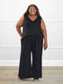 Janelle open back wide leg jumpsuit for women in Black on model Kimesha, size 3X @Kimesha-3X 