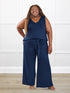 Janelle open back wide leg jumpsuit for women in Navy on model Kimesha, size 3X @Kimesha-3X 