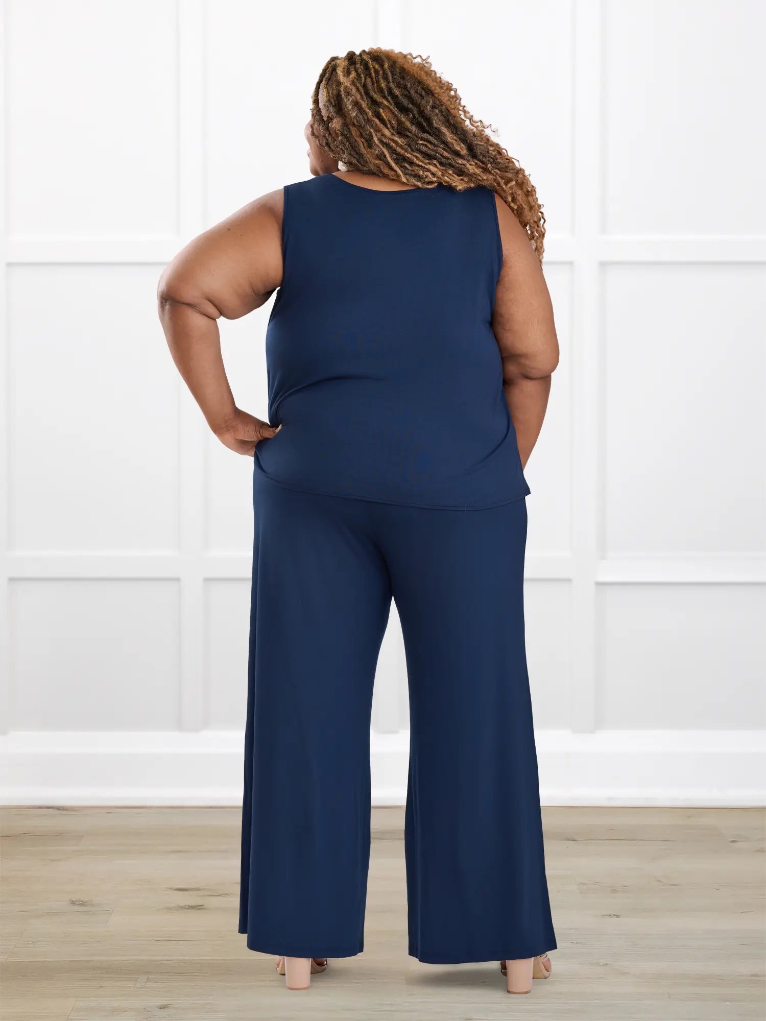 Janelle open back wide leg jumpsuit for women in Navy on model Kimesha, size 3X @Kimesha-3X 