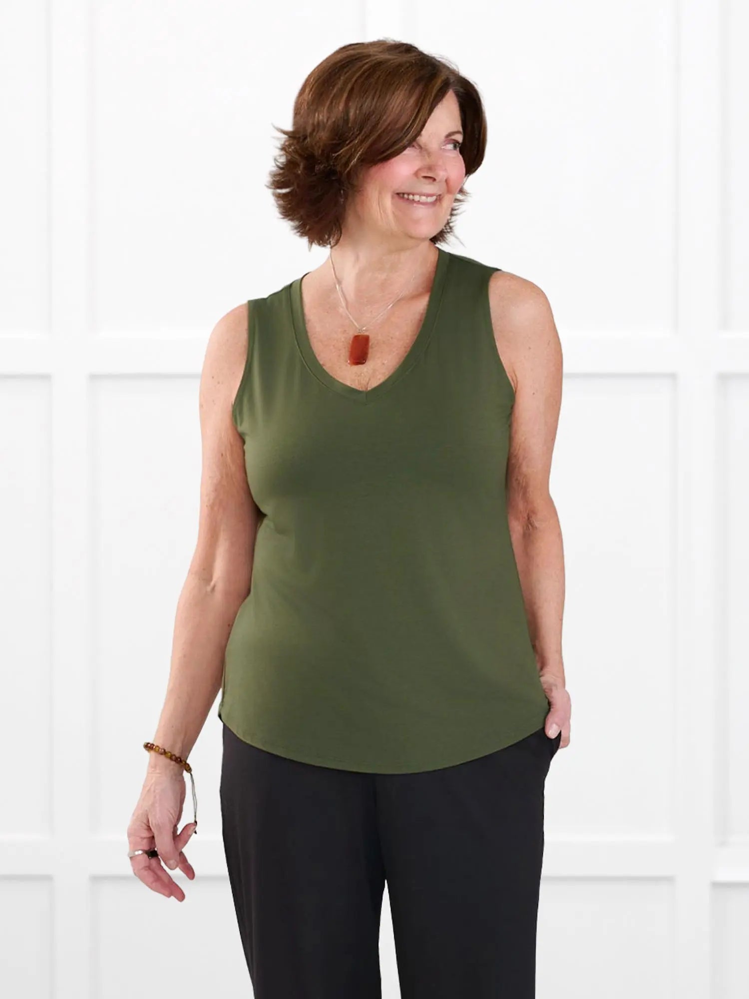 Jules v neck sleeveless top for women in Cactus green on model Donna, size S @Donna-S 