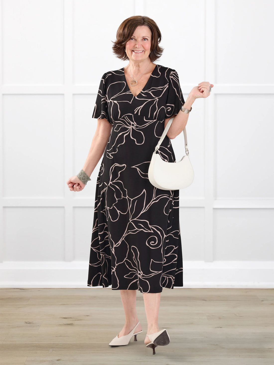 Juliana flutter sleeve midi dress for women in Contour floral on model Donna, size S Regular @Donna-S-regular 