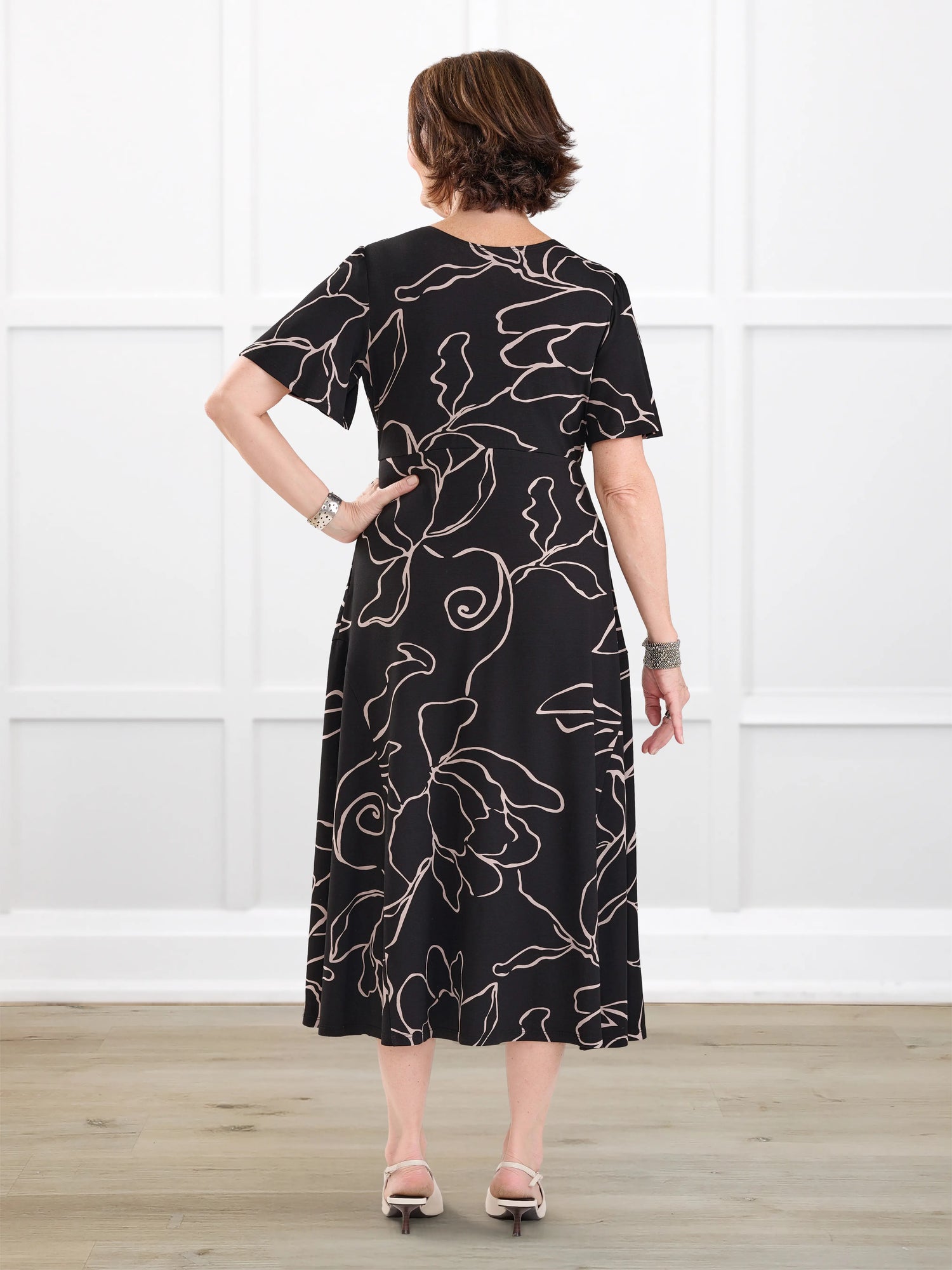 Juliana flutter sleeve midi dress for women in Contour floral on model Donna, size S Regular @Donna-S-regular 