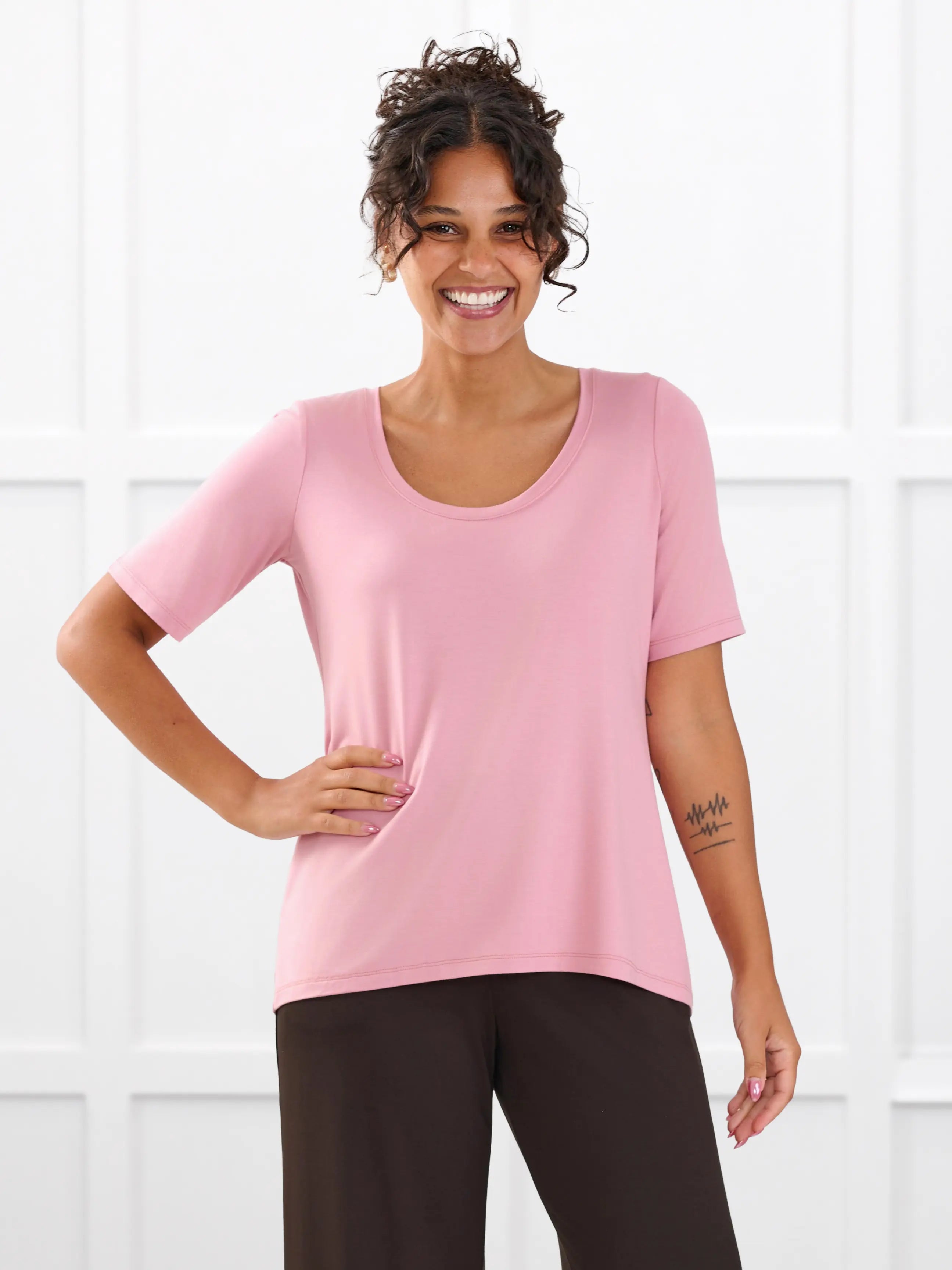 Julita scoop neck half sleeve tee for women in Rosebud on model Meron, size XS @Meron-XS 