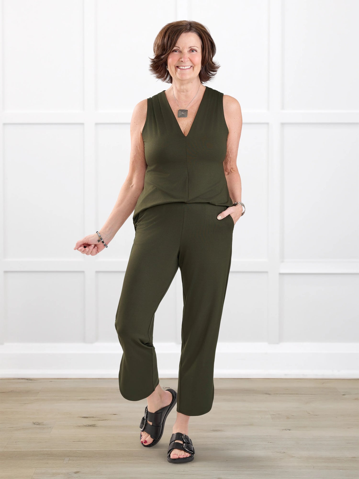 Juna open back dressy capri jumpsuit for women in Olive on model Donna, size S @Donna-S 
