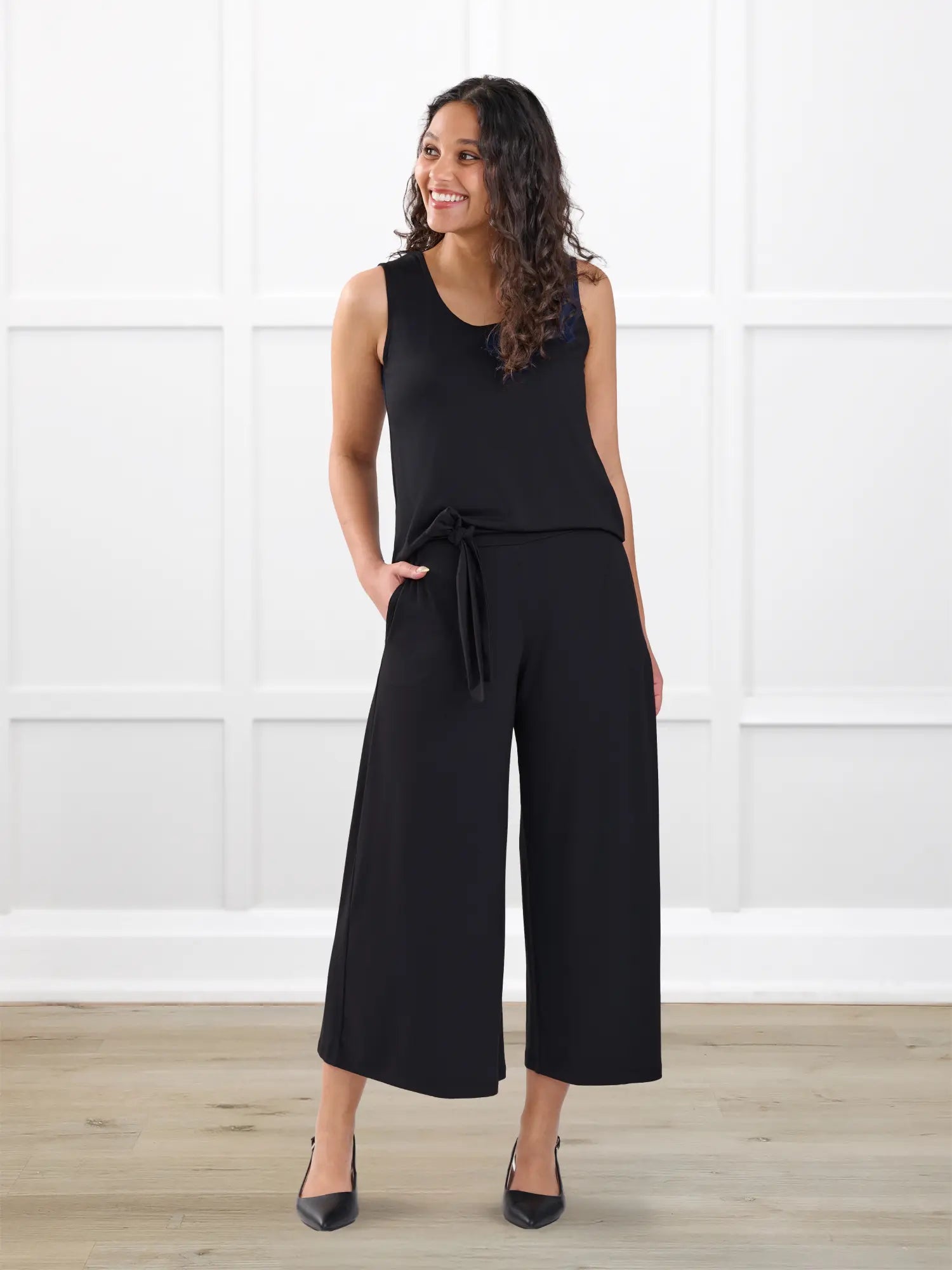 Kavita open back capri jumpsuit for women in Black on model Meron, size XS @Meron-XS-regular 