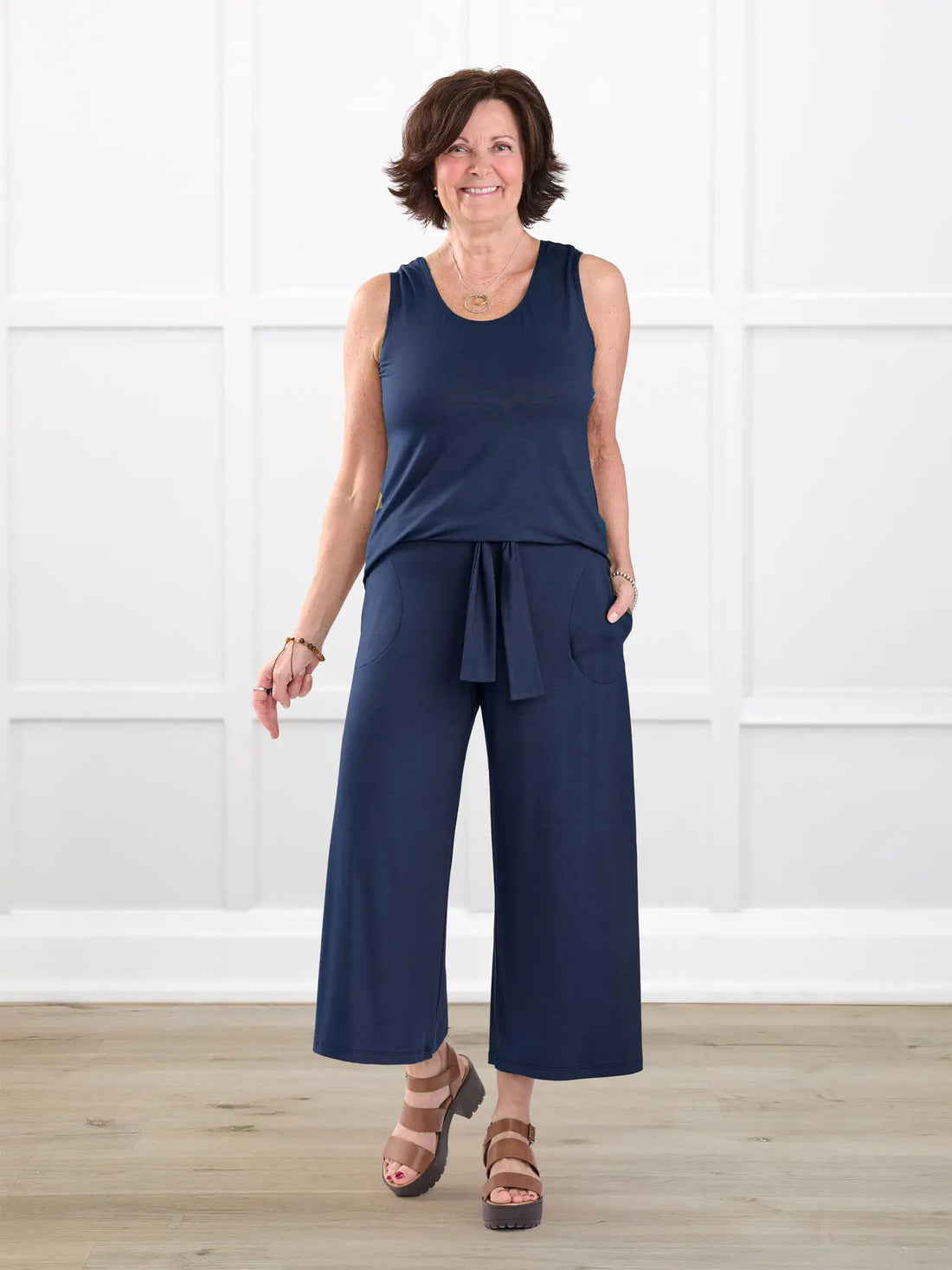 Kavita open back capri jumpsuit for women in Navy on model Donna, size S @Donna-S-regular 