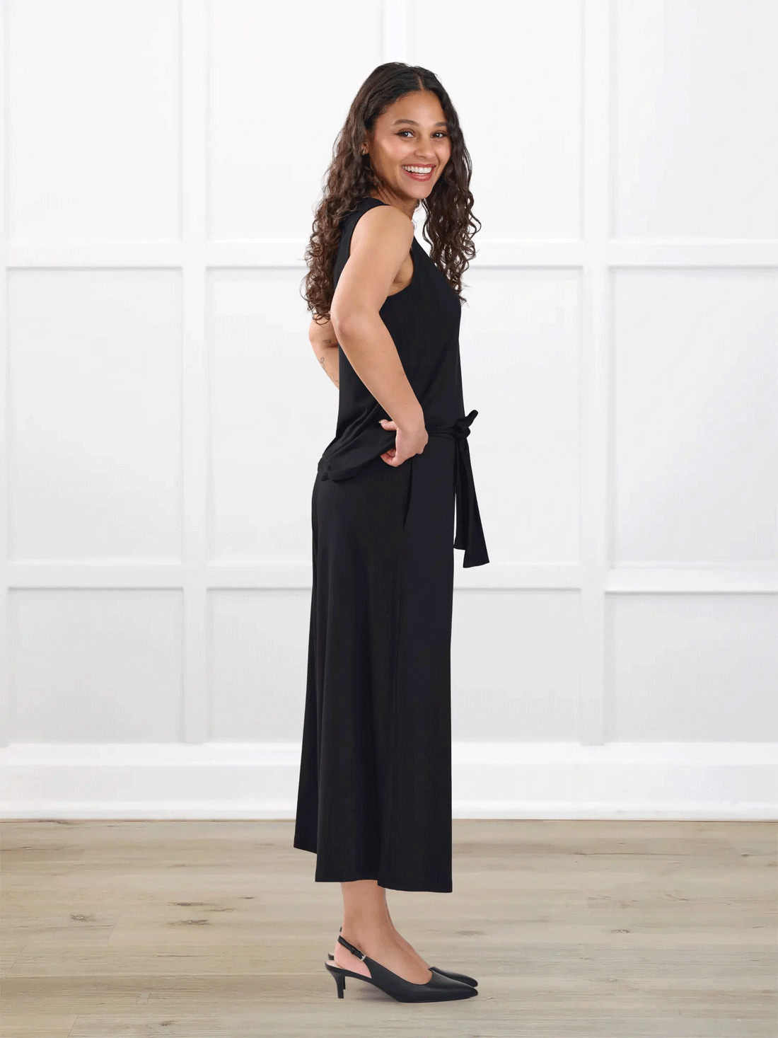 Kavita open back capri jumpsuit for women in Black on model Meron, size XS @Meron-XS-regular 