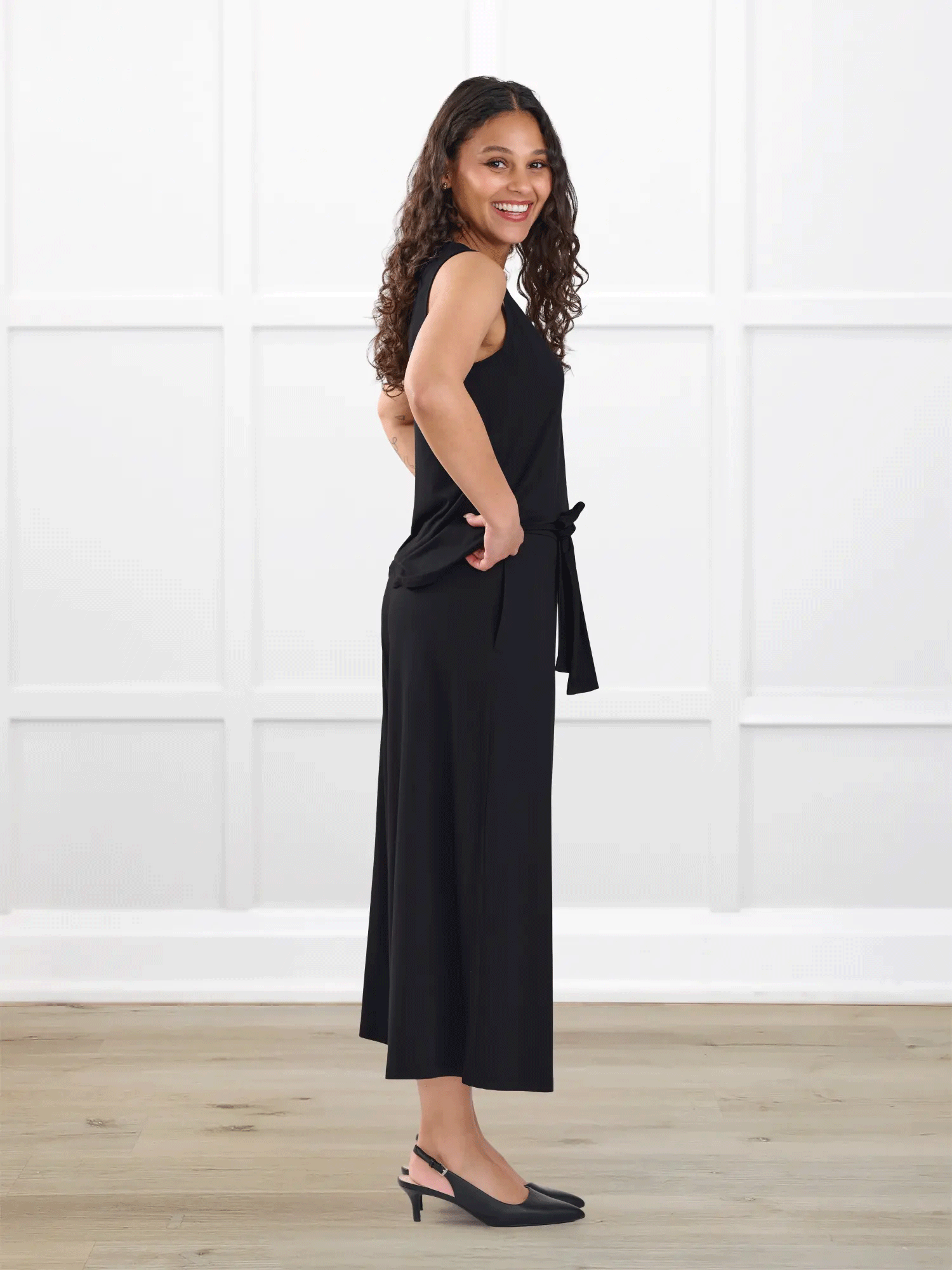 Kavita open back capri jumpsuit for women in Black on model Meron, size XS @Meron-XS-regular 