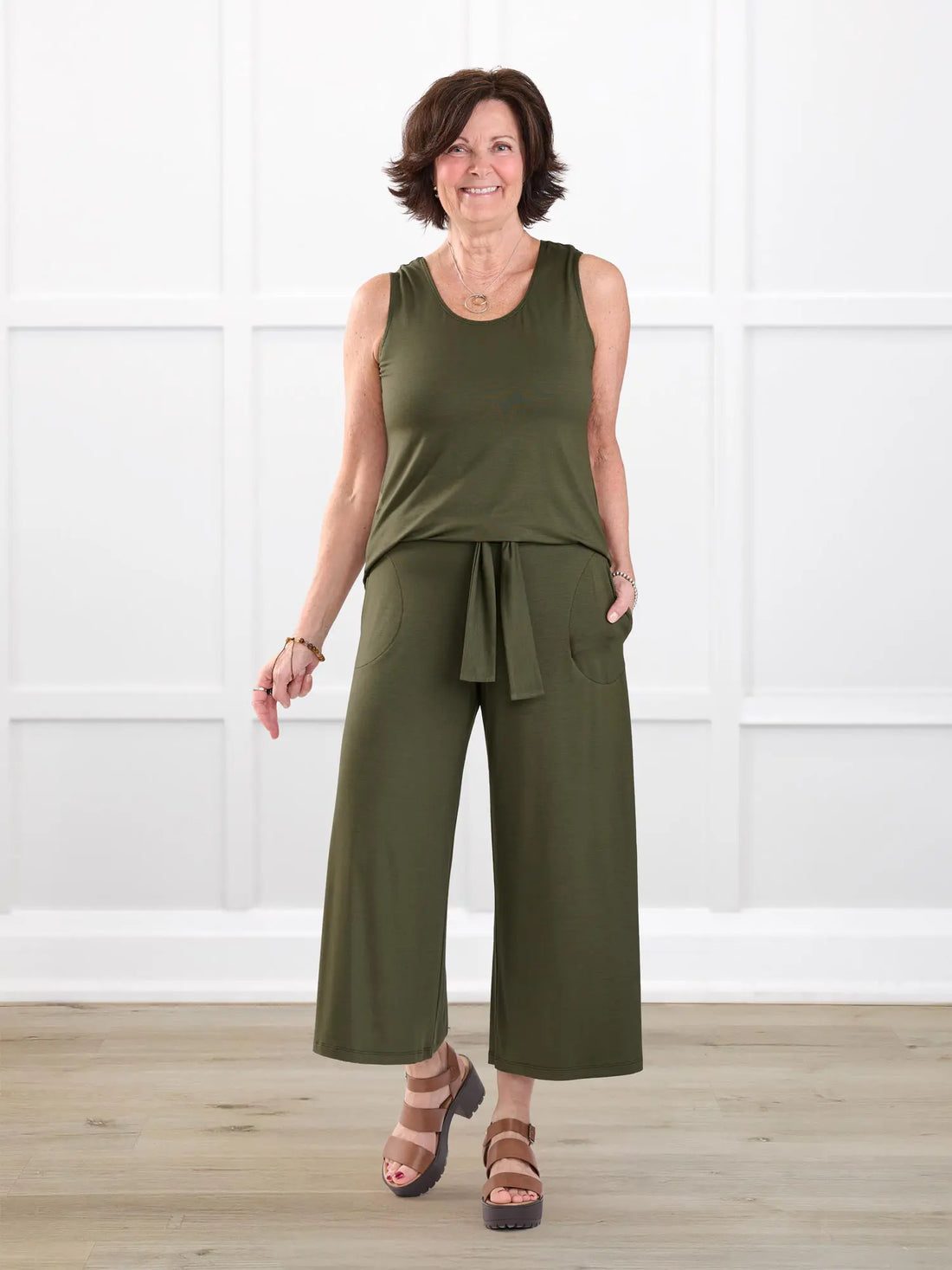 Kavita open back capri jumpsuit for women in Cactus green on model Donna, size S @Donna-S 