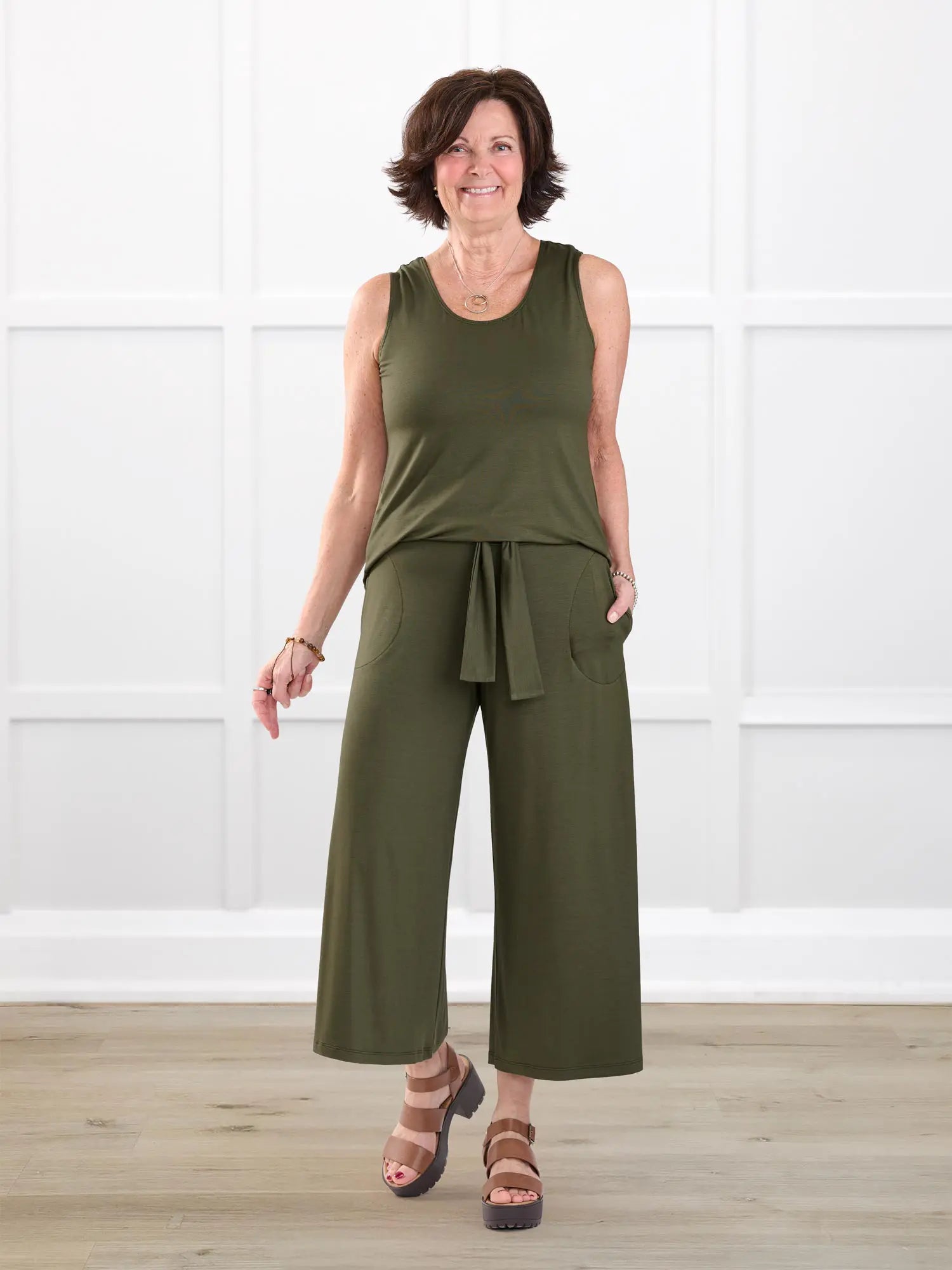 Kavita open back capri jumpsuit for women in Cactus green on model Donna, size S @Donna-S 