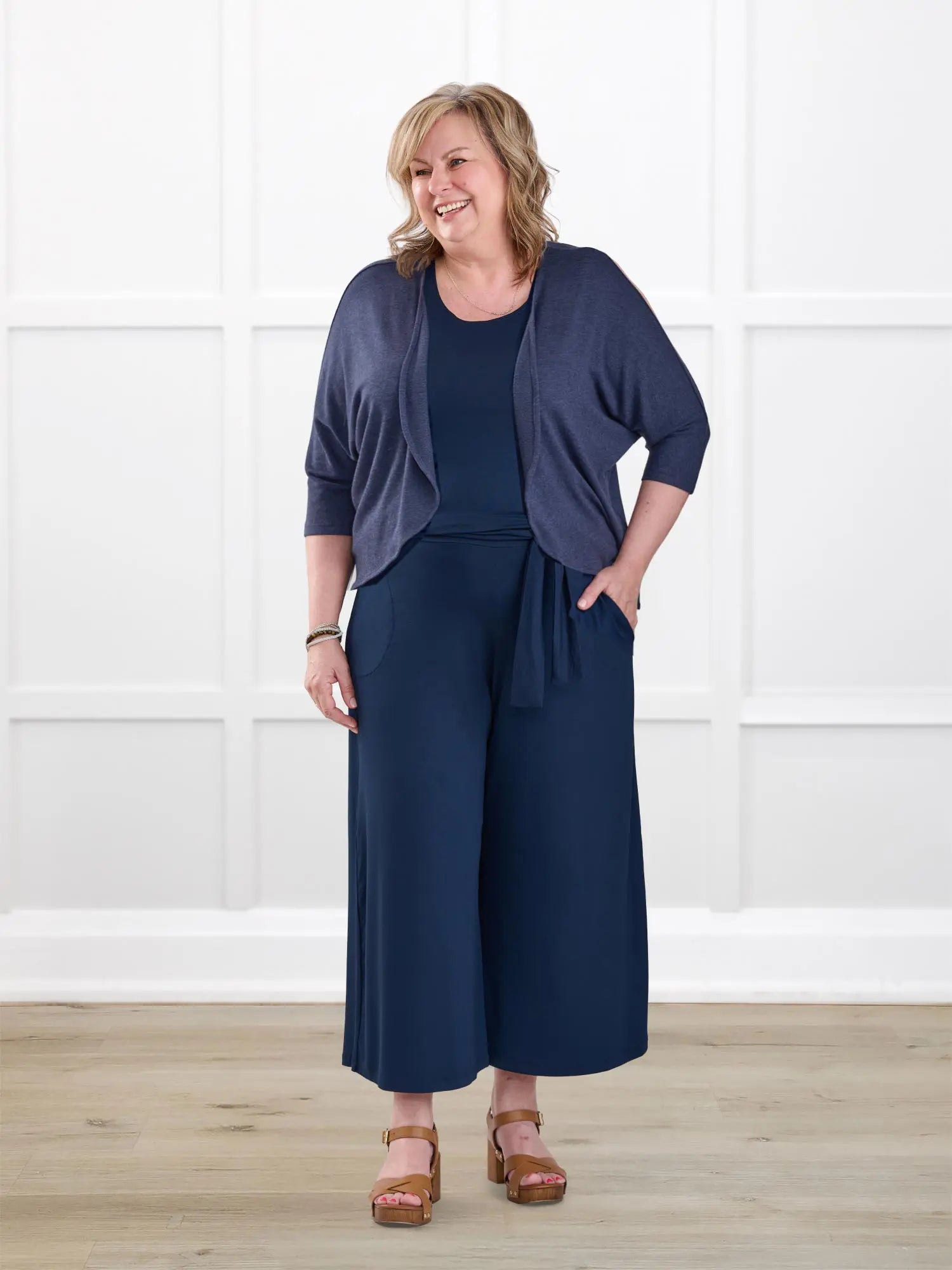 Kavita open back capri jumpsuit for women in Navy on model Deb, size XL @Deb-XL-regular 