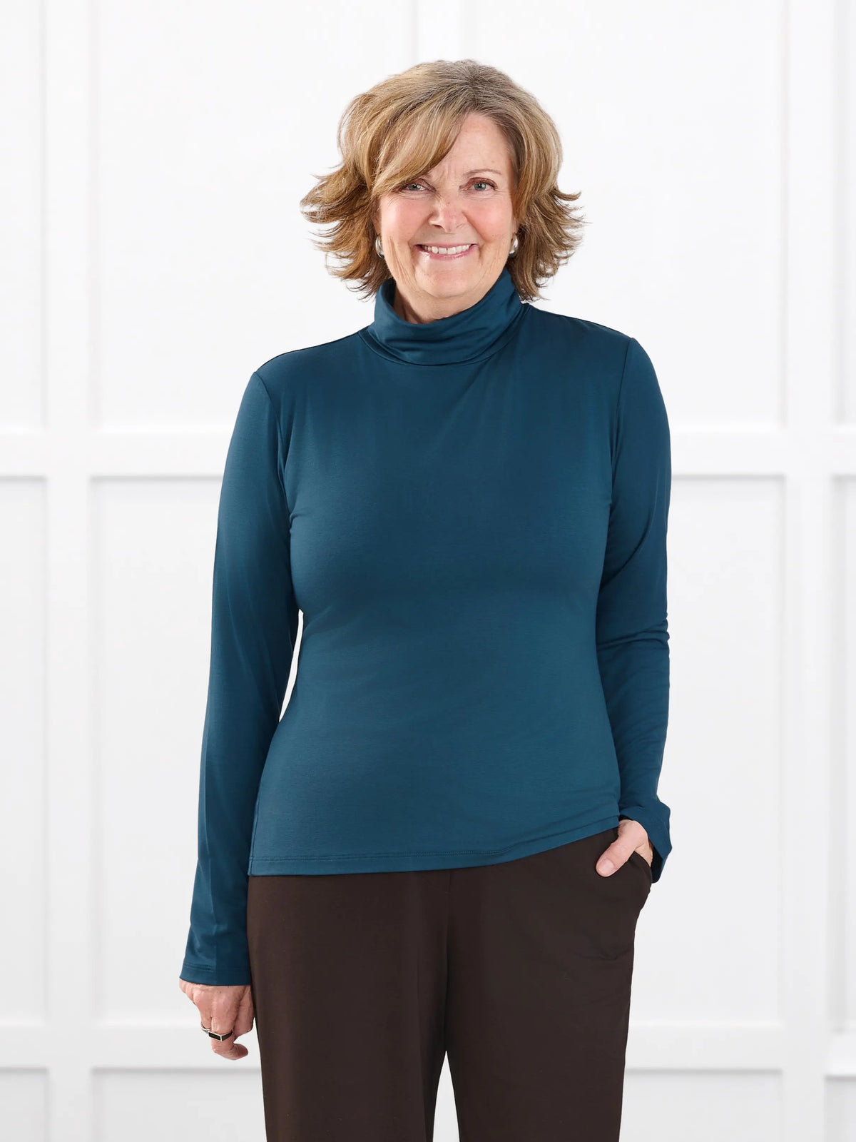 Kerry turtleneck top for women in Atlantic on model Donna, size S @Donna-S 