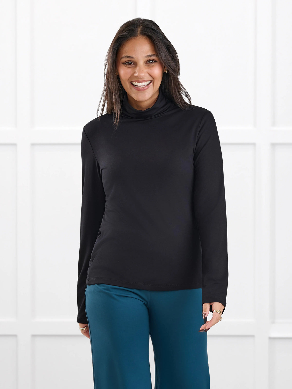 Kerry turtleneck top for women in Black on model Meron, size XS @Meron-XS 