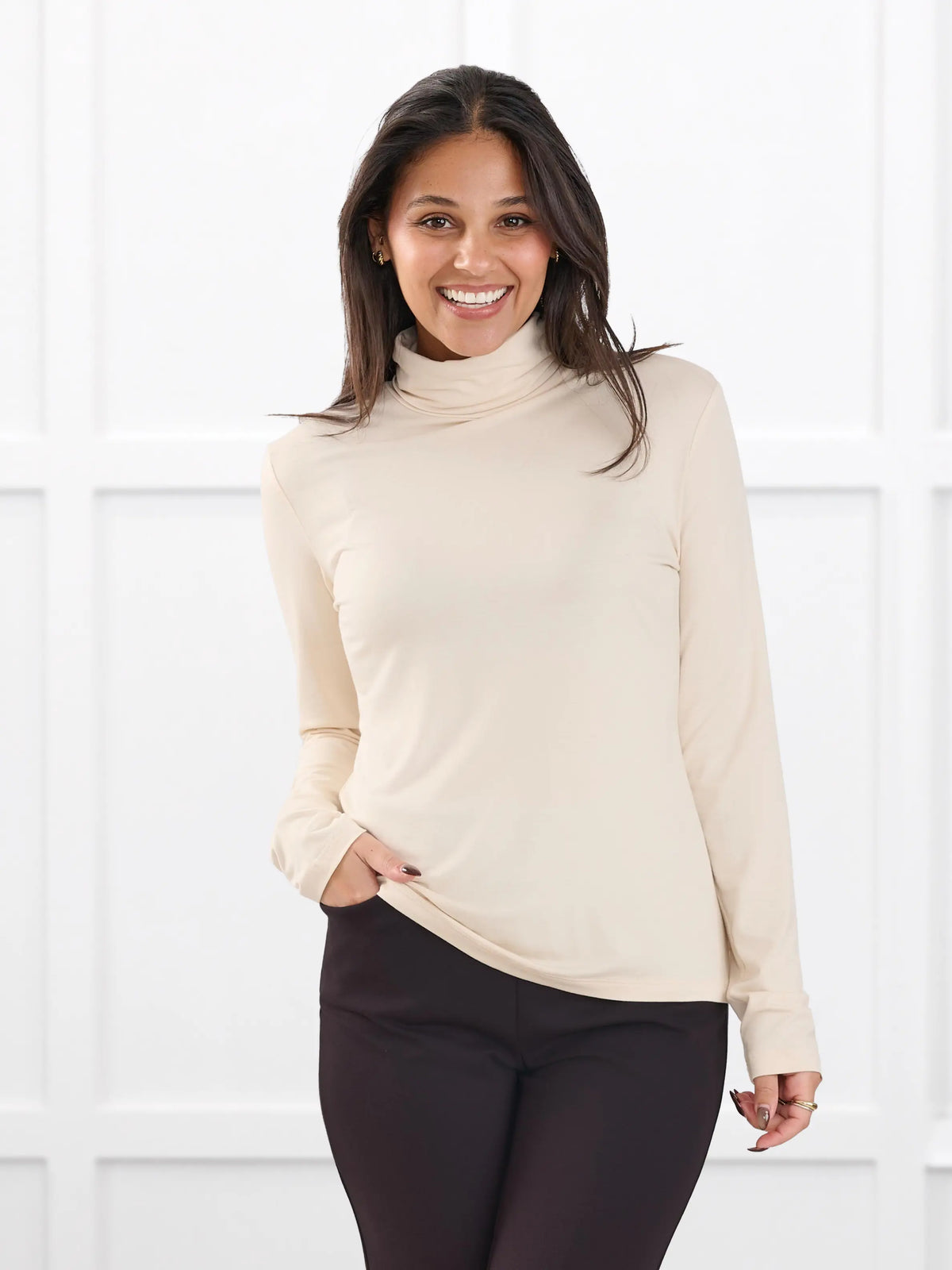 Kerry turtleneck top for women in Shortbread on model Meron, size XS @Meron-XS 