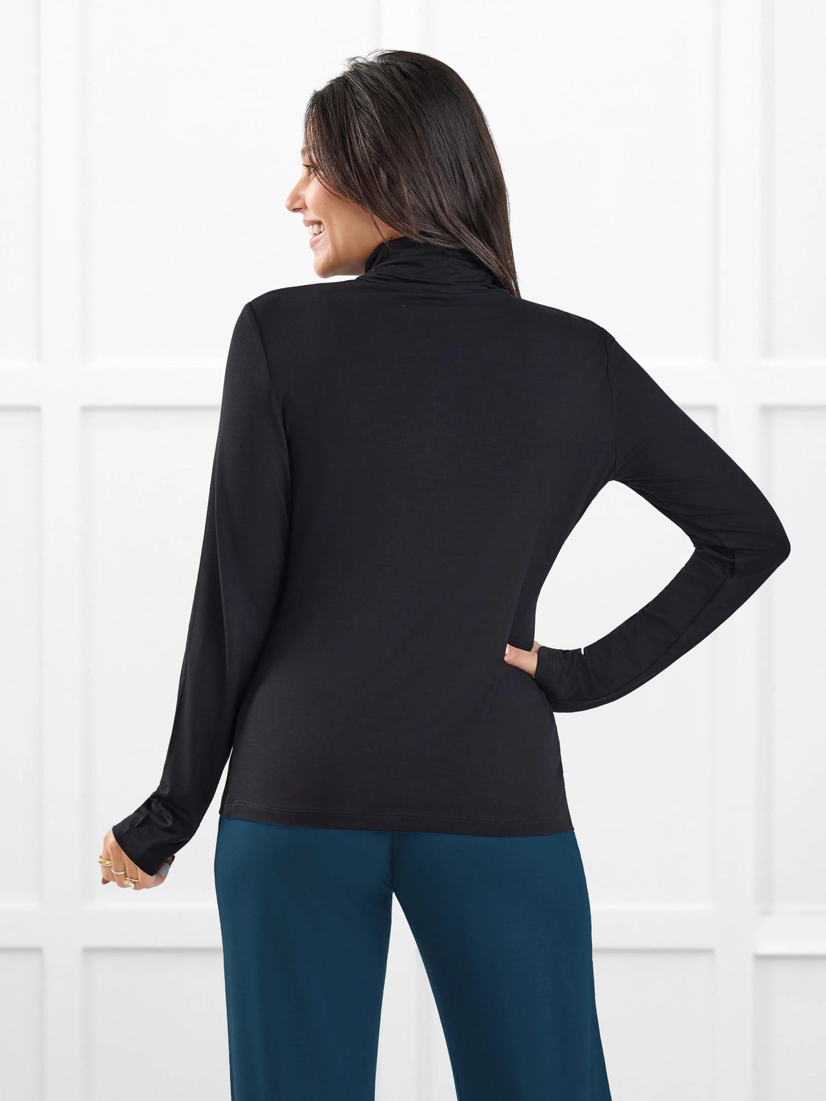 Kerry turtleneck top for women in Black on model Meron, size XS @Meron-XS 