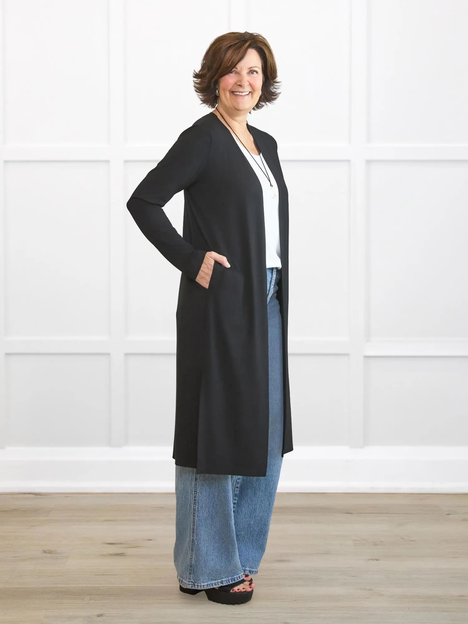 Larissa duster cardigan with pockets for women in Black on model Donna, size S Regular @Donna-S-regular 