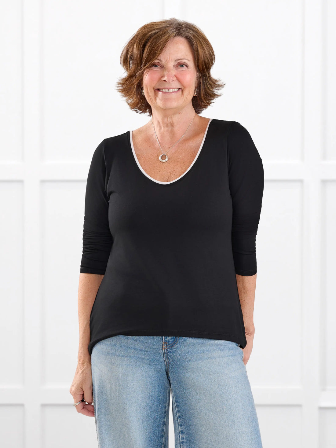 Liv v neck long sleeve top for women in Black white on model Donna, size S Regular @Donna-S-regular 