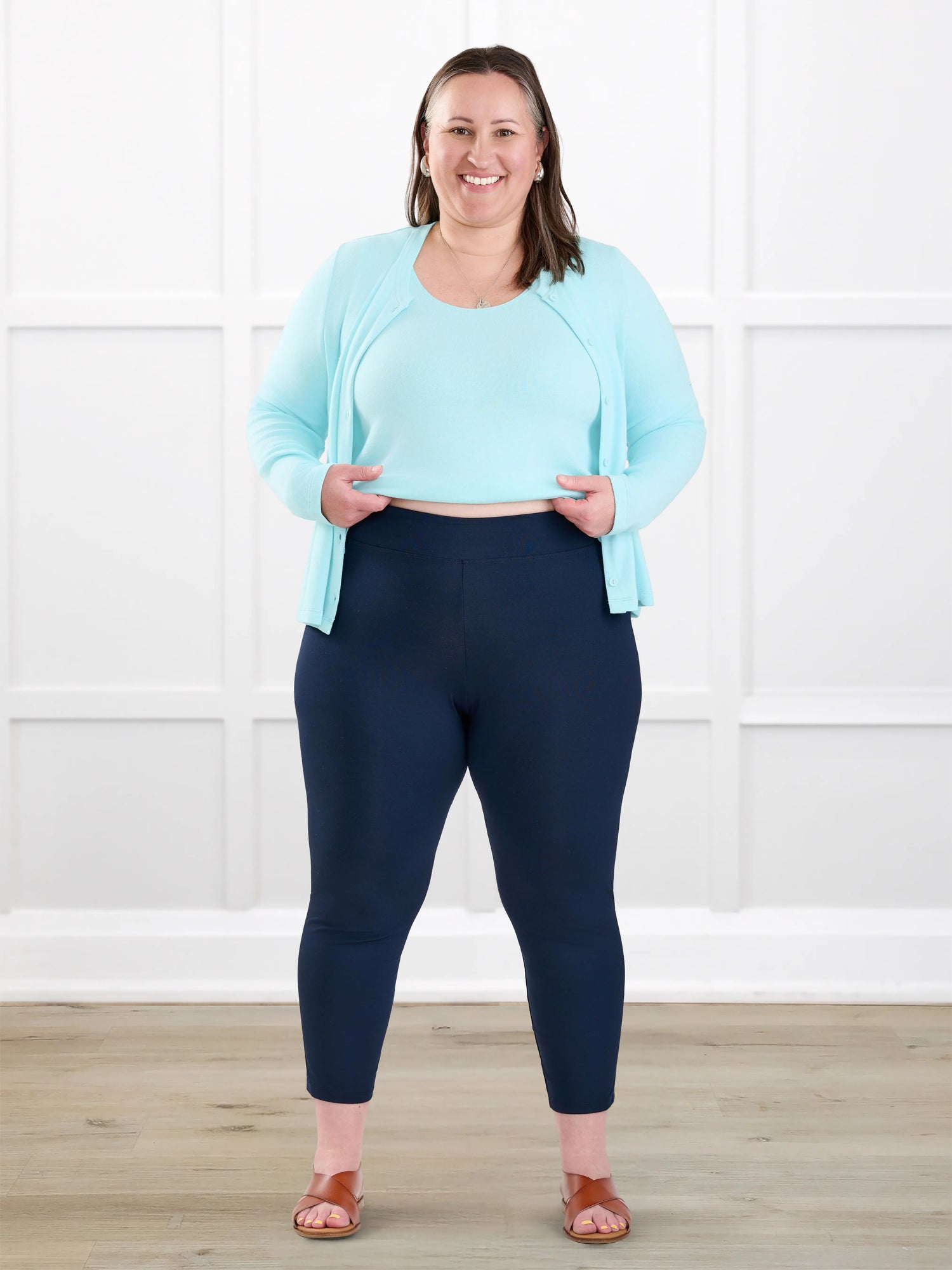 Lucy mid rise capri legging for women in Navy on model Cristina, size XXL @Cristina-XXL 