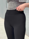 Close up of Miik's Lucy mid-rise legging in black.  
