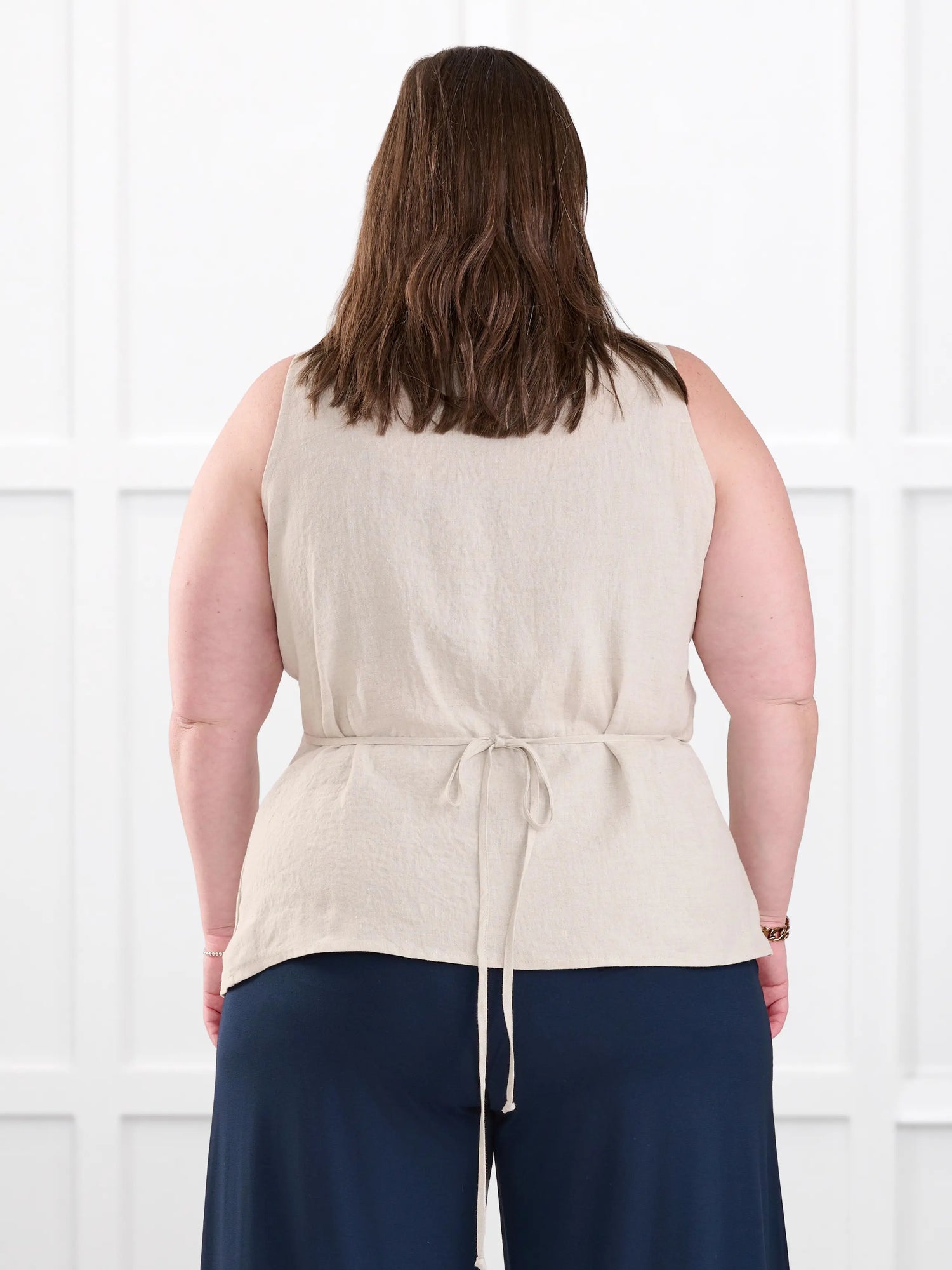Regina sleeveless linen wrap top for women in Sand linen on model Cristina, size XXL @Cristina-XXL 