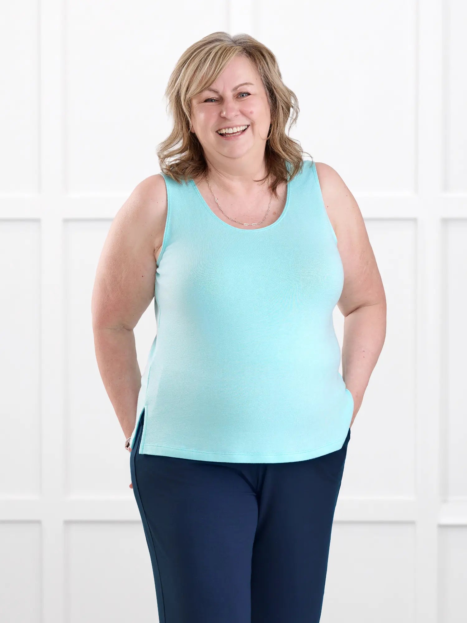 Ricki reversible neckline sweater knit tank for women in Fiji blue on model Deb, size XL @Deb-XL 